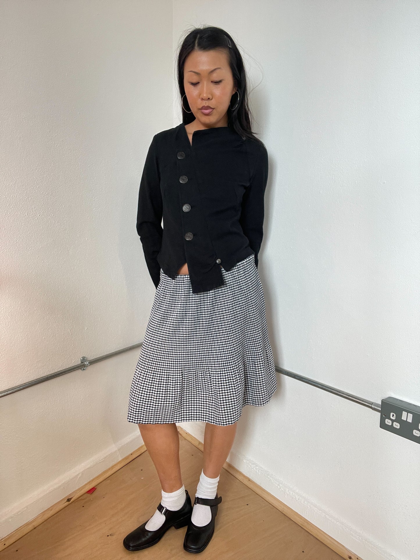 Black asymetrical button cop copine top