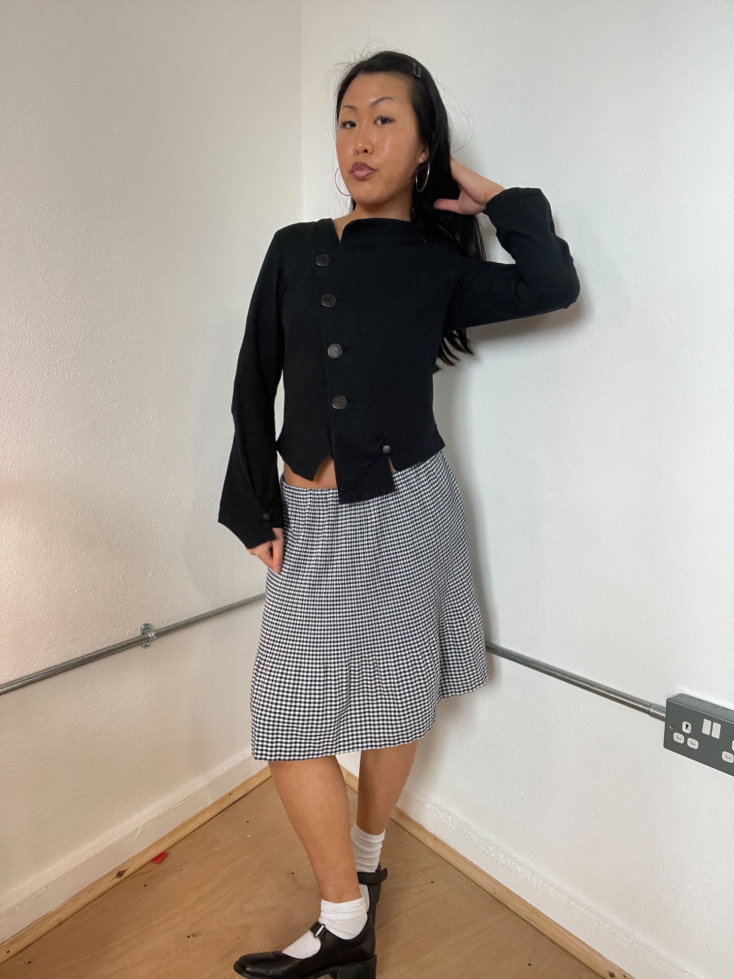 Black asymetrical button cop copine top