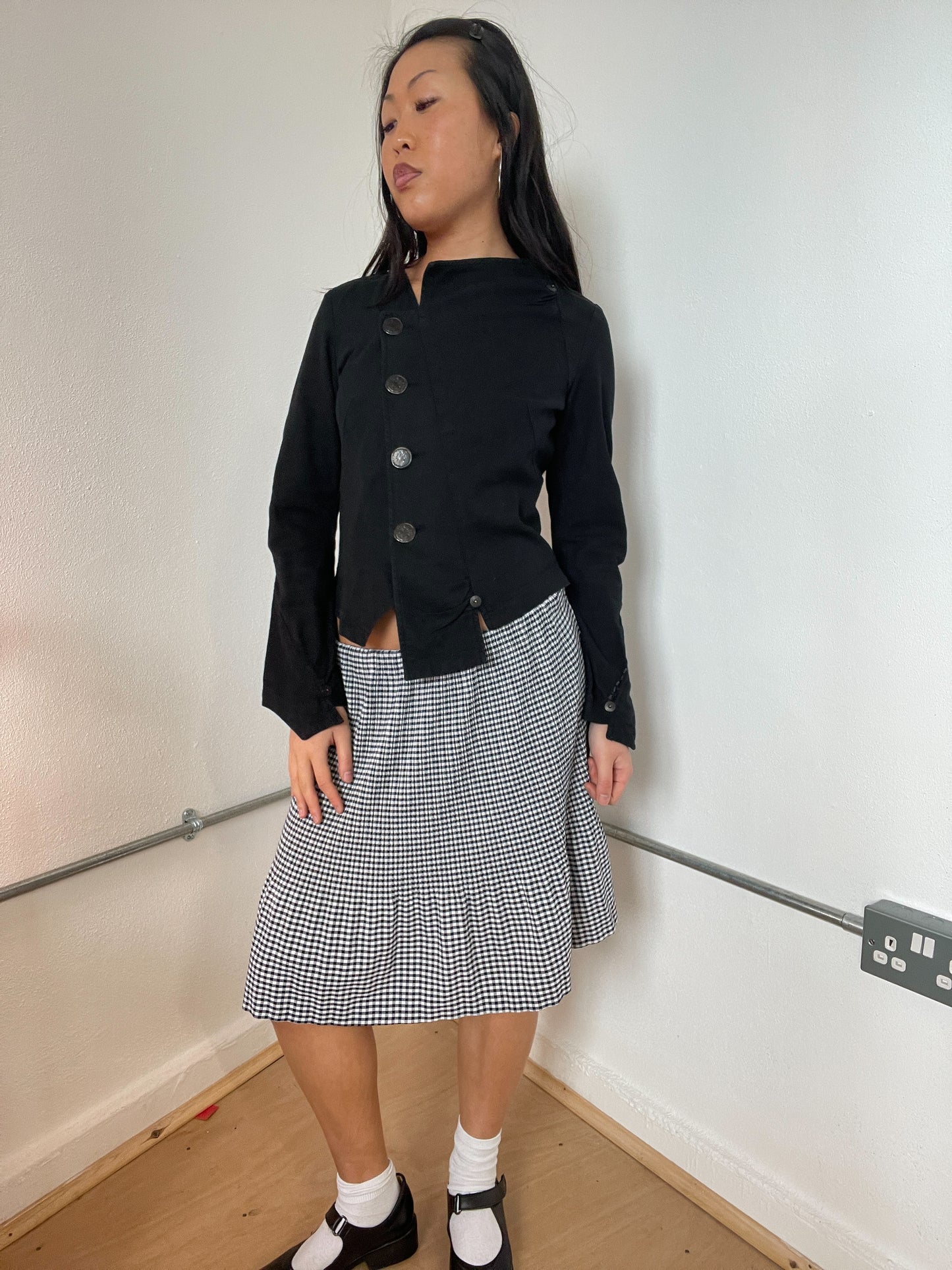 Black asymetrical button cop copine top