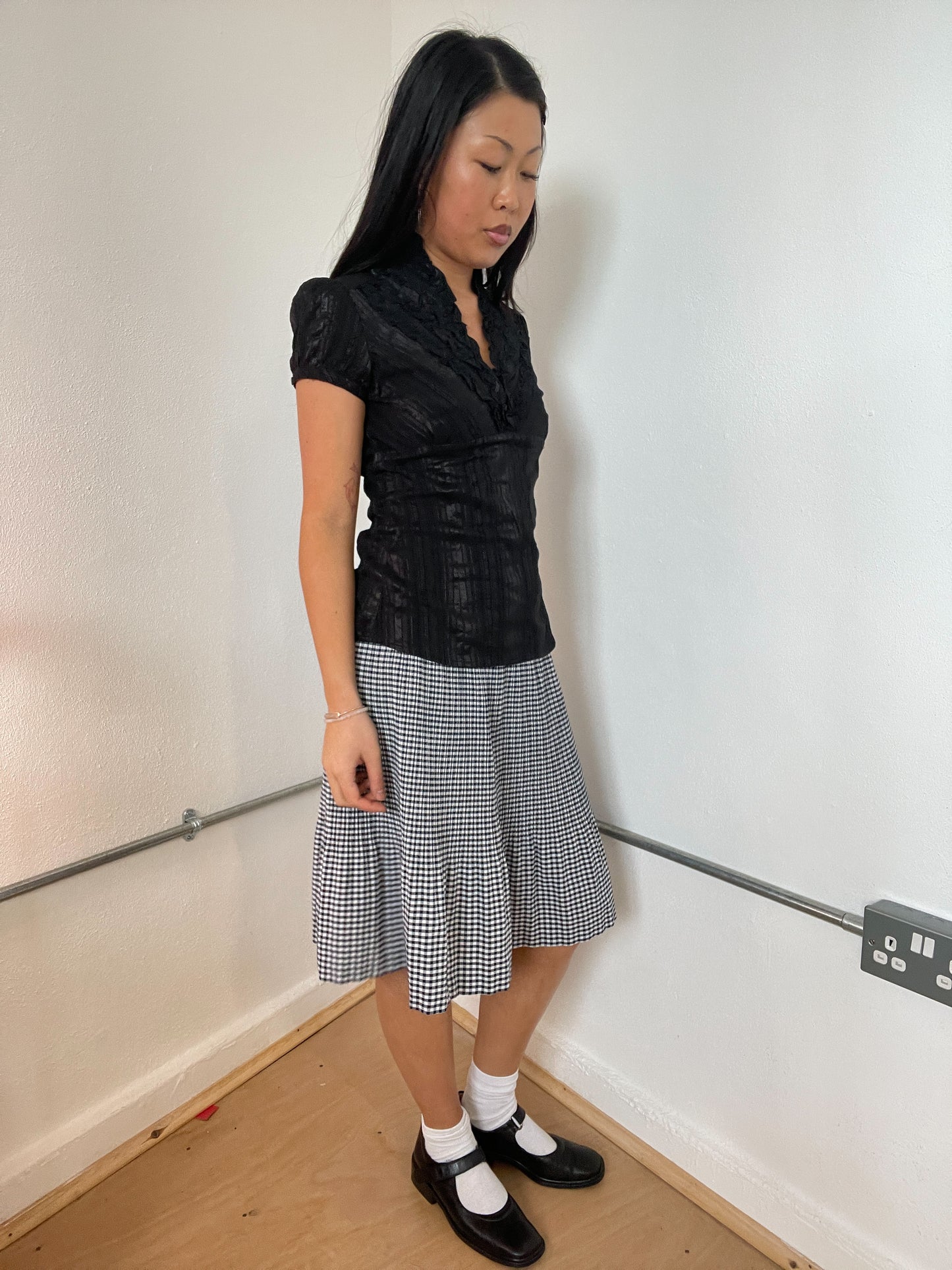 Black patterned frilly top